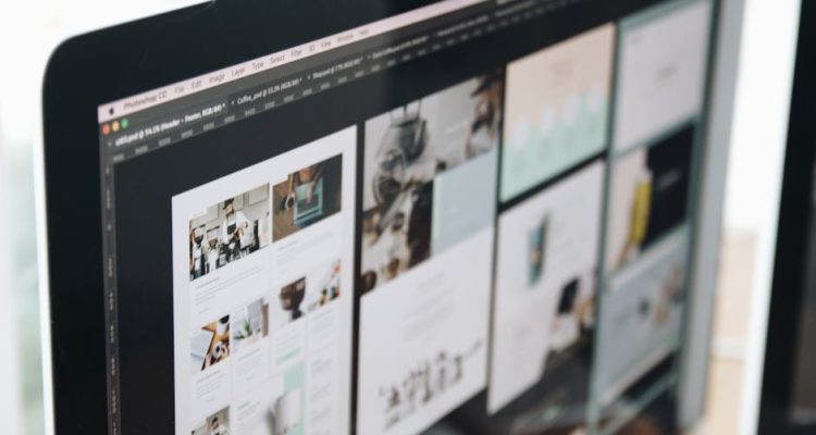 A modern computer screen displaying web design work, showcasing creative visuals in a workspace.